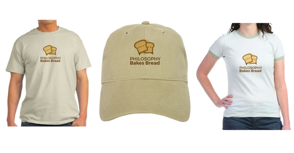 Photo of a men's tshirt, a cap, and a woman's tshirt, each featuring the Philosophy Bakes Bread logo.