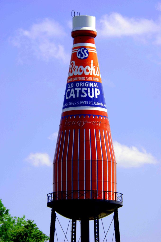 Photo of a water tower made to look like a "catsup" bottle.