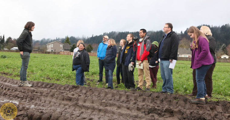 Image of Food Symposium participants visiting Mother Earth Farms in Washington state.