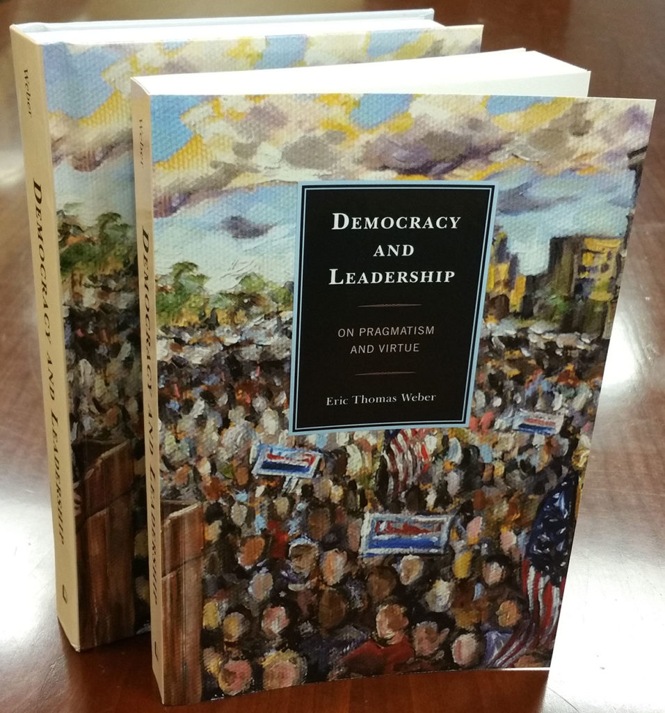 Cover of Democracy and Leadership, which features a painting of a crowd at a political event. 