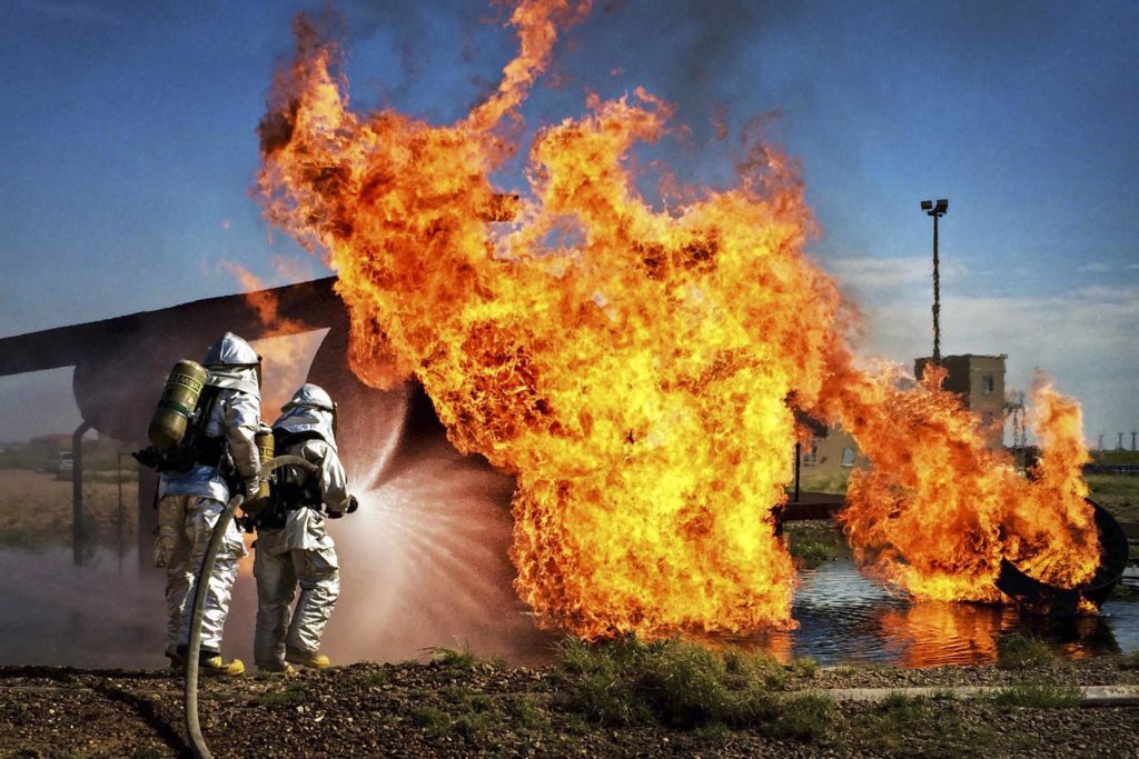 Airforce commandos extinguishing an aircraft fire.