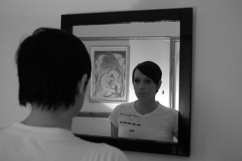 Woman looking in the mirror