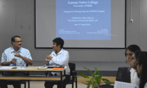 Image of the Shining Network SOPHIA Chapter meeting, featuring a projected screen in the background with the title of the event, "The Nature of Good and Daily Life."