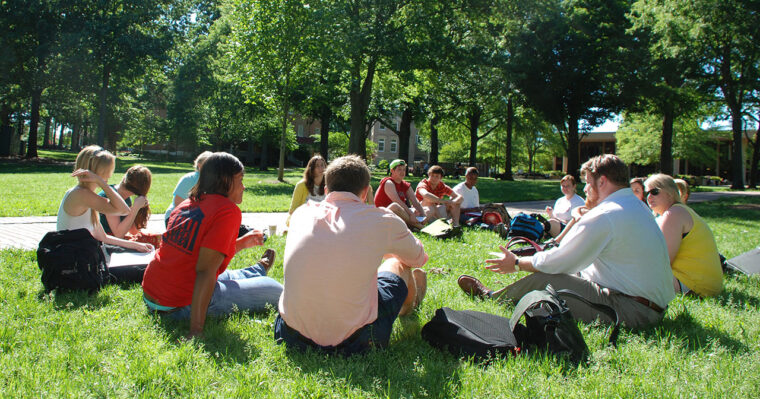 Class in discussion outside on the campus of the University of Mississippi. 